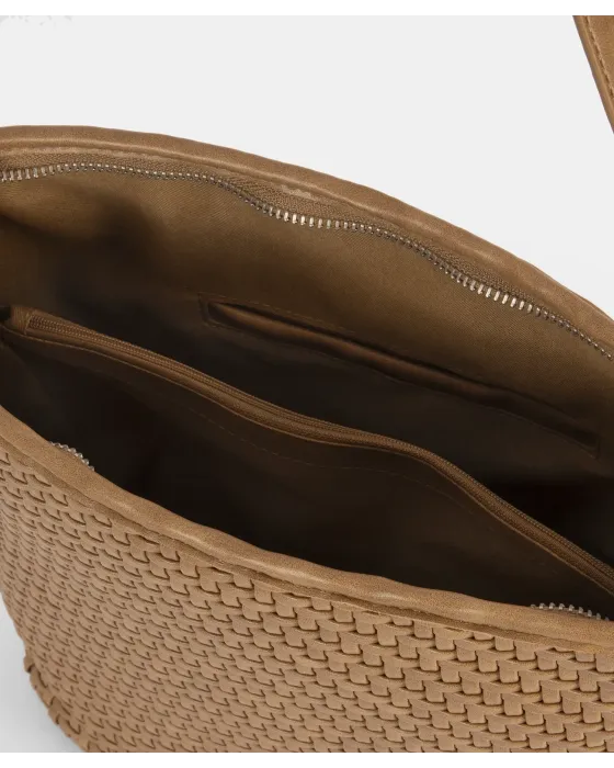 El bolso que puede con todo (y con estilo). 🐚✨