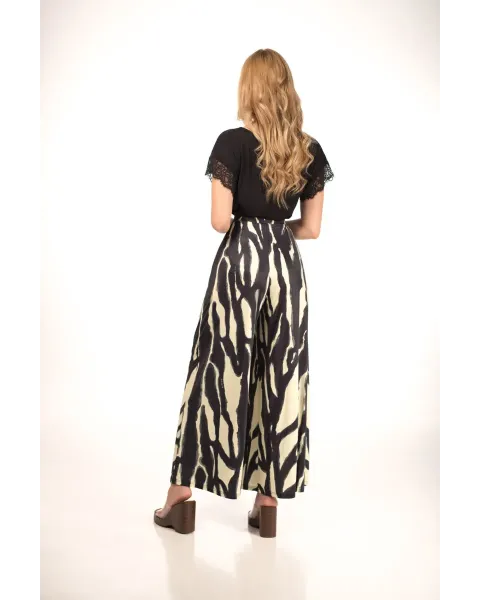 Pantalones Malalá Arami | Palazzo Animal Print Negro y Crema | Maldita